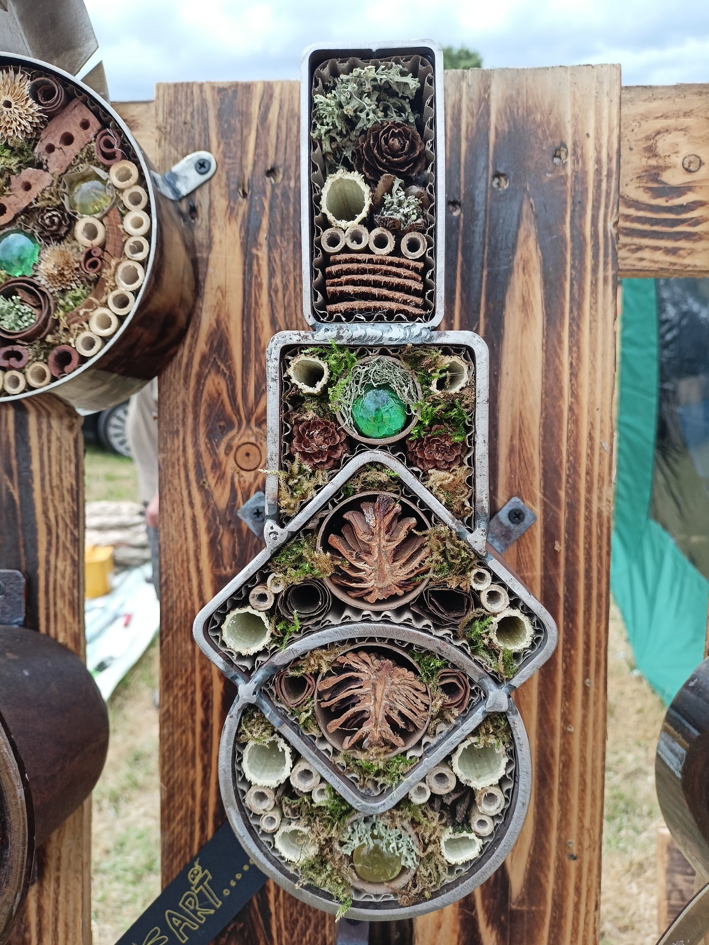 Geometric bug house combining round, square and rectangular section steel