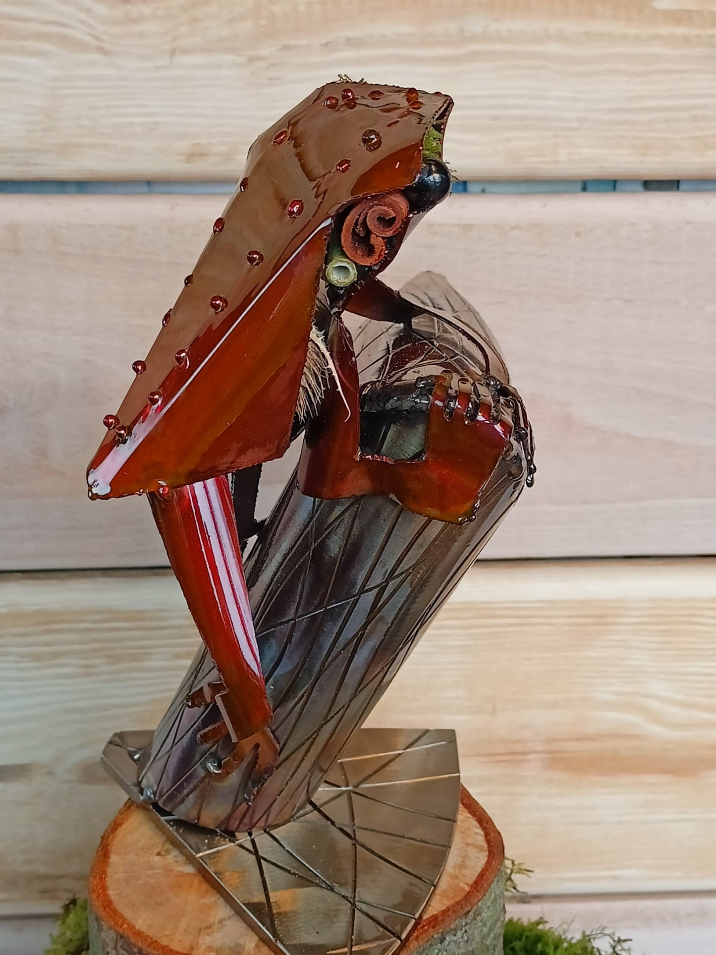 Red Tree Frog sitting on a branch inspired sculpture made from 100% upcycled metal