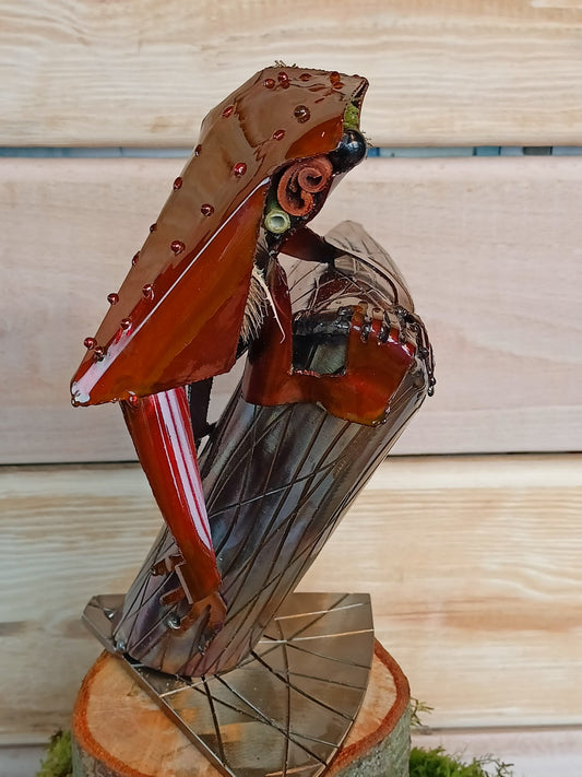 Red Tree Frog sitting on a branch inspired sculpture made from 100% upcycled metal