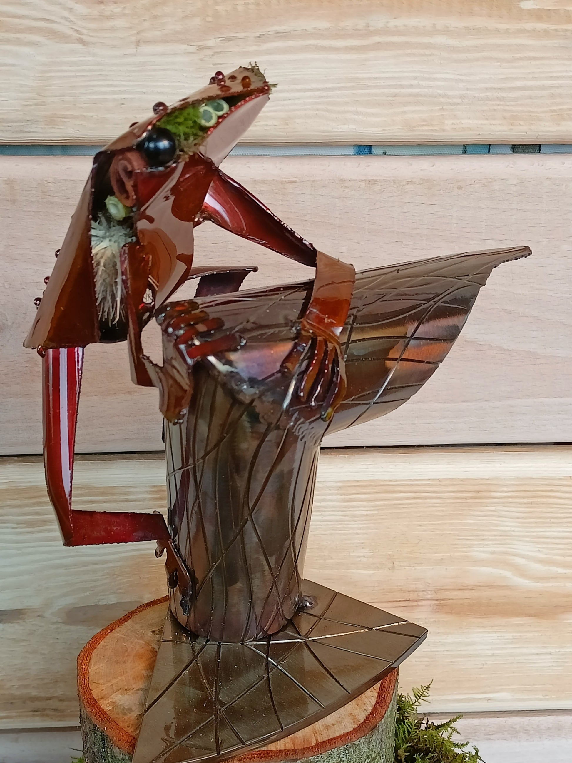 Red Tree Frog sitting on a branch inspired sculpture made from 100% upcycled metal