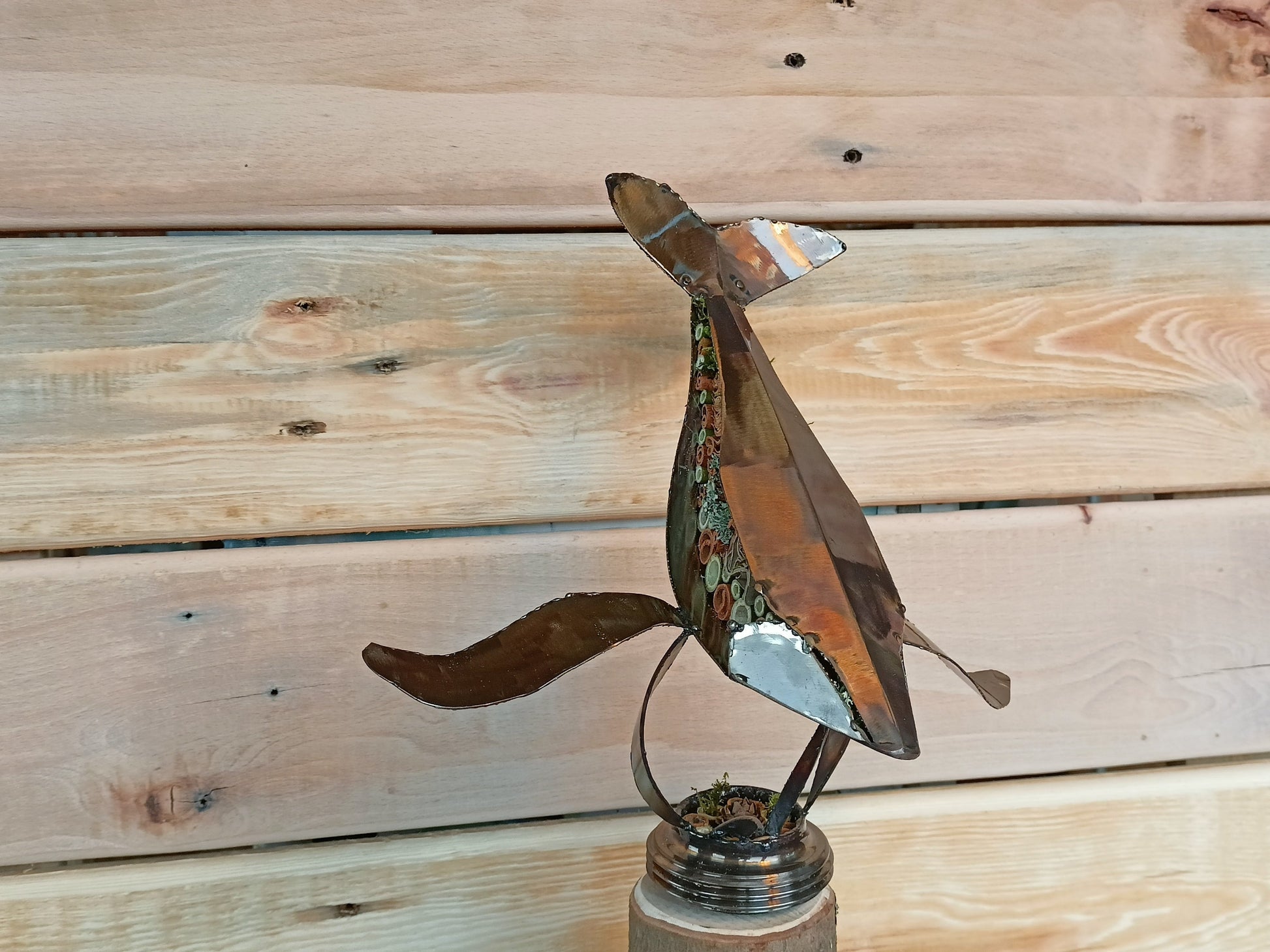 humpback whale filled with organics and swimming through the air.
