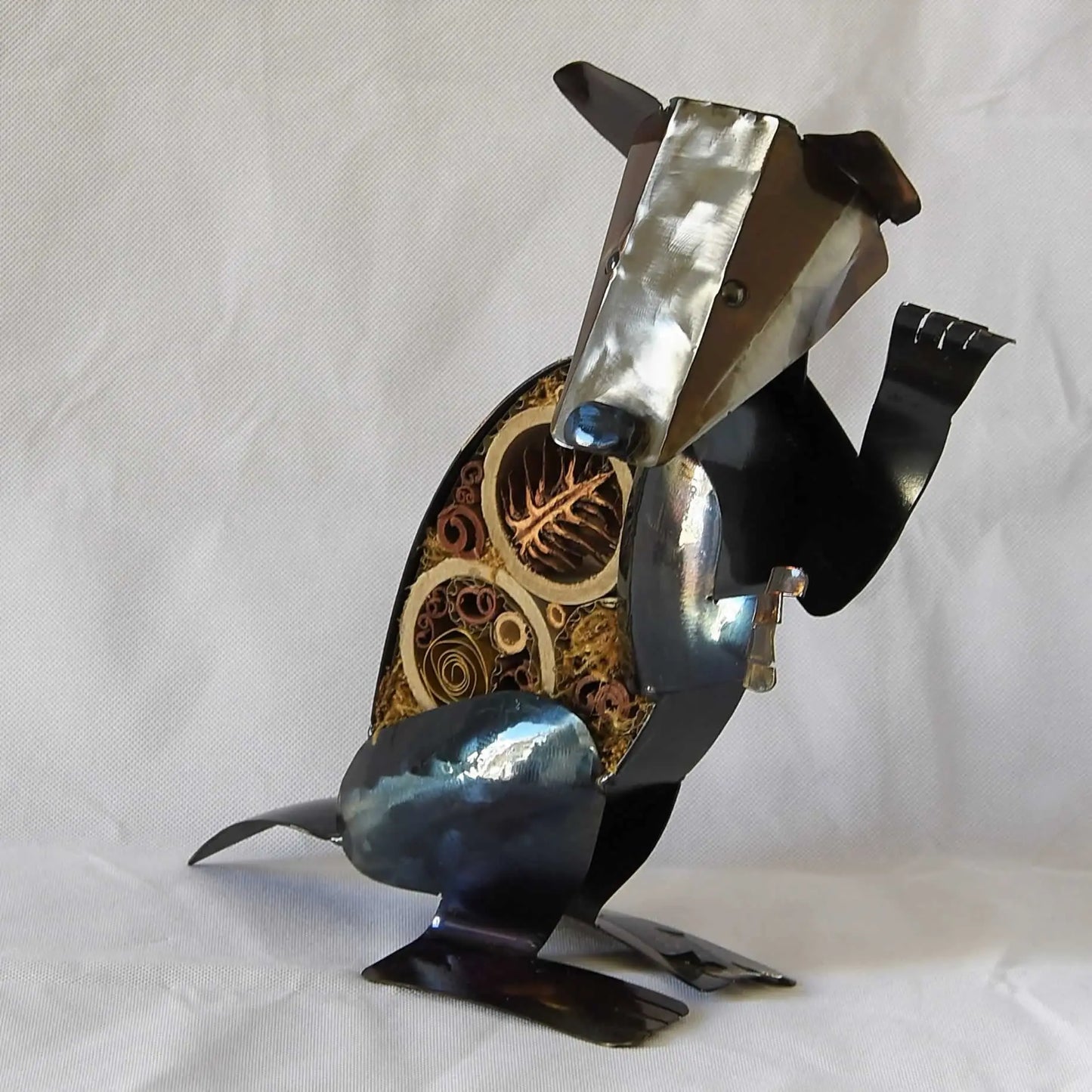 badger garden sculpture with insect refuge