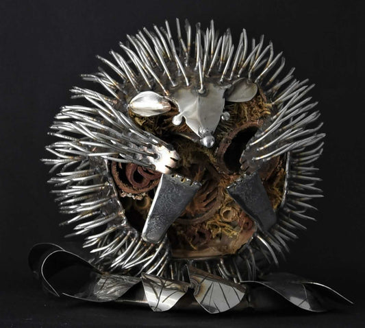 Erin the curled hedgehog in stainless steel with bug house