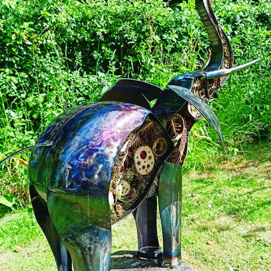 Stunning Elephant in upcycled metal. Vibrant purple and blue colouring has been added by heating with a blow torch.
